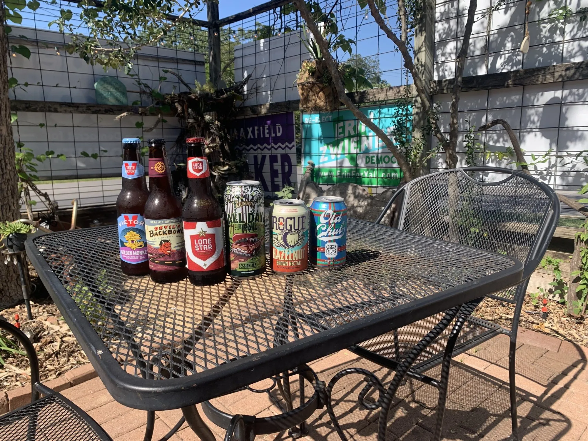 Texas craft beers lined up on a courtyard table